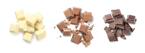 Conjunto Com Diferentes Deliciosos Pedaços Chocolate Fundo Branco Vista Superior — Fotografia de Stock
