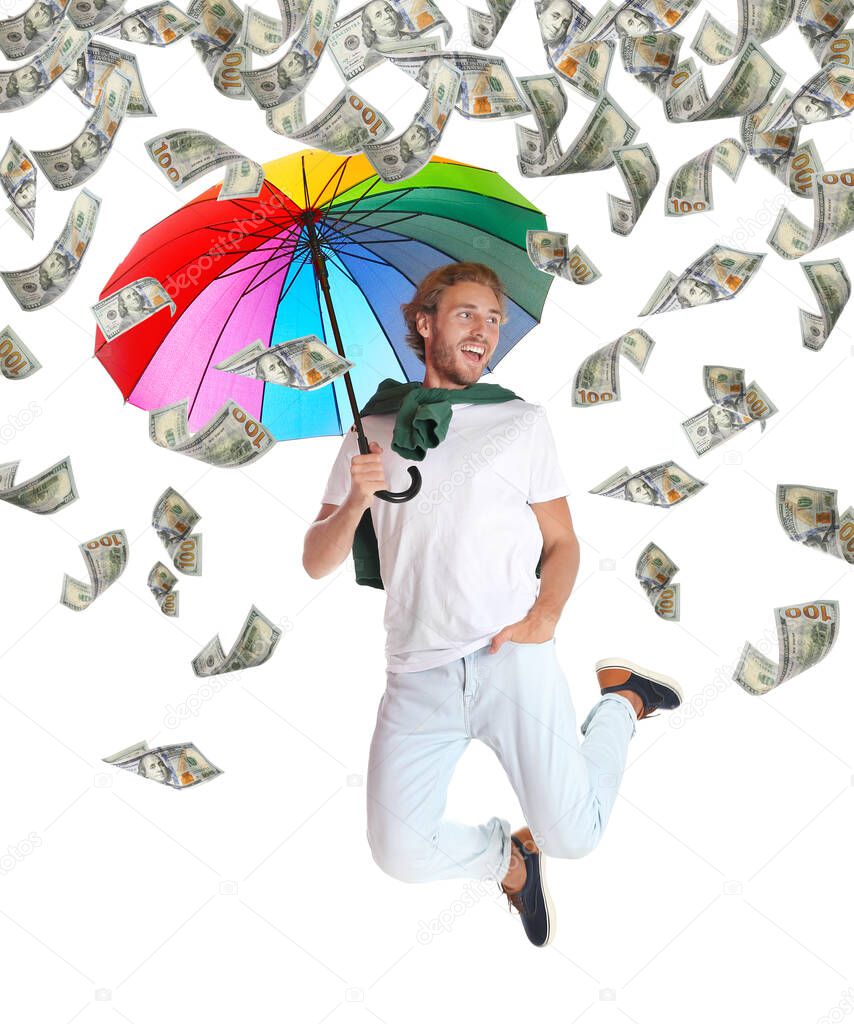 Man with rainbow umbrella under money rain on white background 