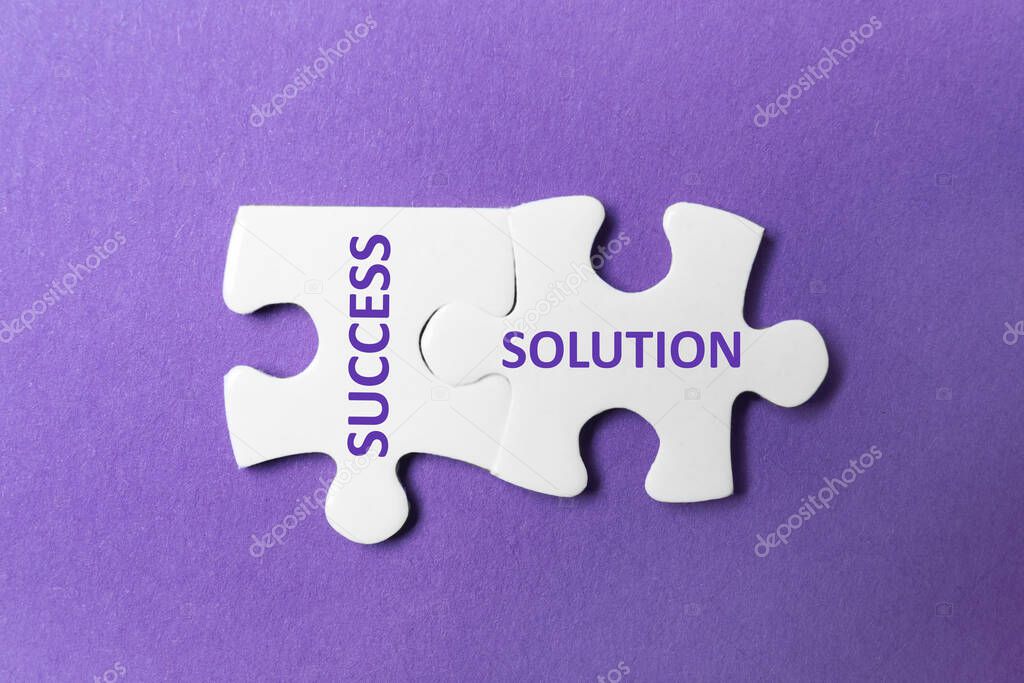 Unfitting white puzzle pieces with words SUCCESS and SOLUTION on purple background, top view