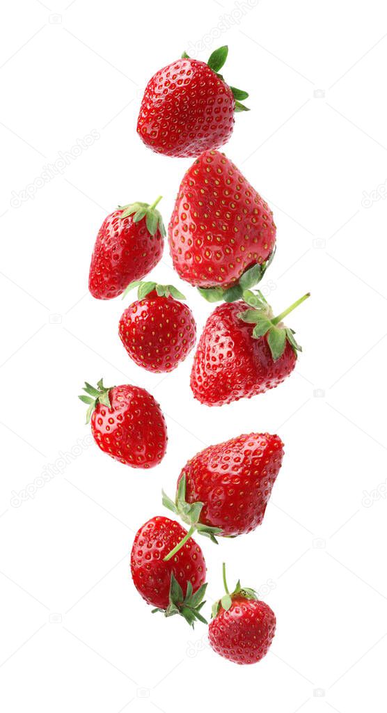 Set with ripe strawberries falling on white background 