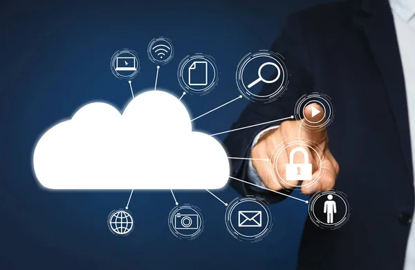 stock image Cloud computing and storage concept. Man pointing at virtual icon on blue background, closeup