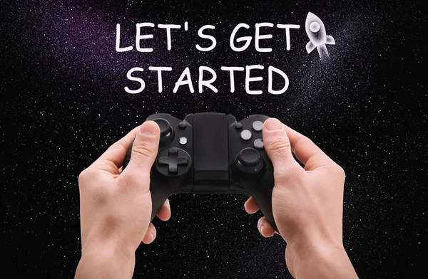 Man with video game controller and phrase LET\'S GET STARTED against night sky, closeup