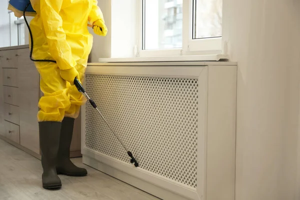 Pest Control Worker Protective Suit Spraying Pesticide Window Indoors Close — стоковое фото