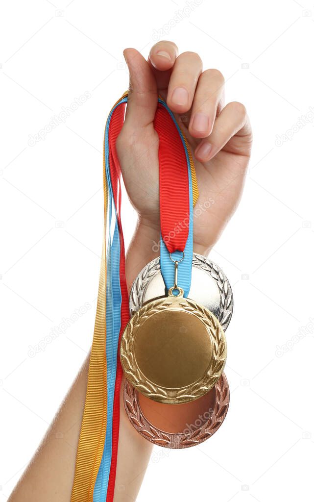 Woman holding medals on white background, closeup. Space for design