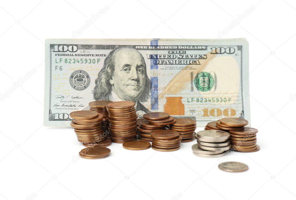 Dollar banknotes and stacks of coins on white background