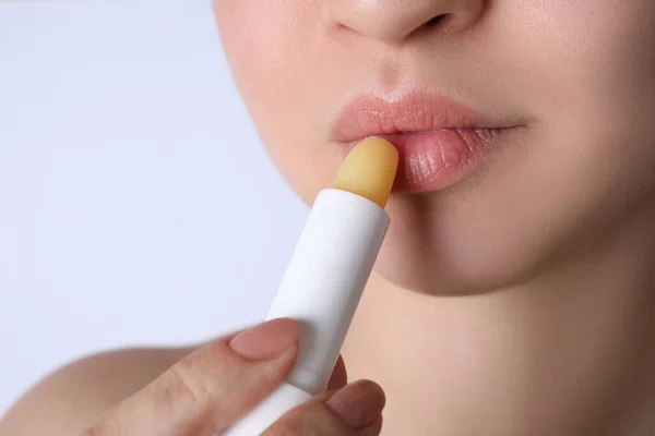 Woman Applying Hygienic Lipstick Lips White Background Closeup — Stock Photo, Image