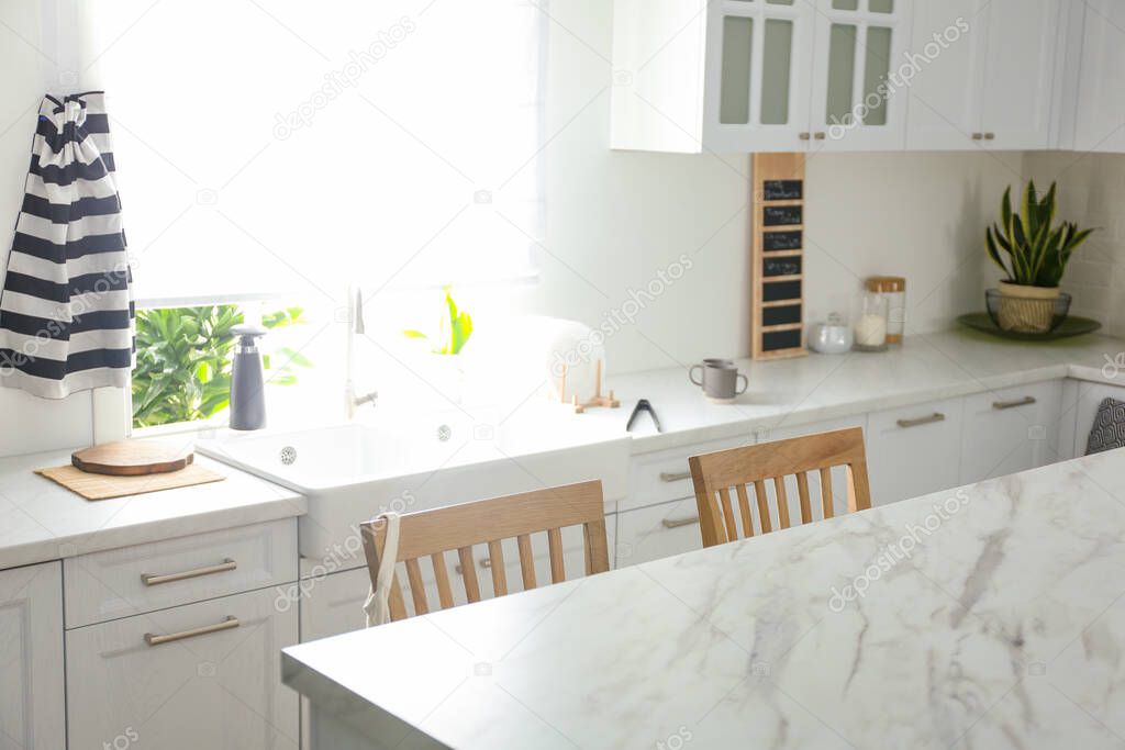 Modern kitchen interior with stylish marble table
