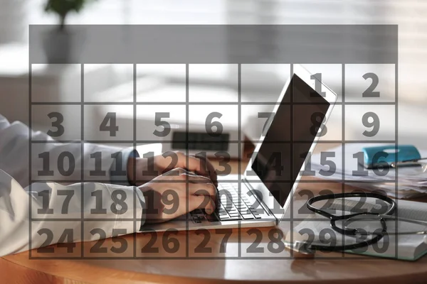 Calendar and doctor working with laptop in office, closeup