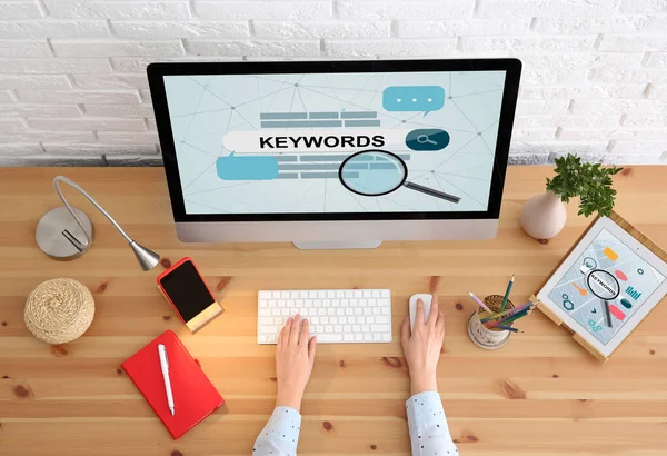 Woman Searching Keywords Computer Wooden Table Top View — Stock Photo, Image