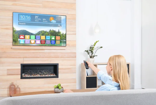 Woman watching smart TV in living room