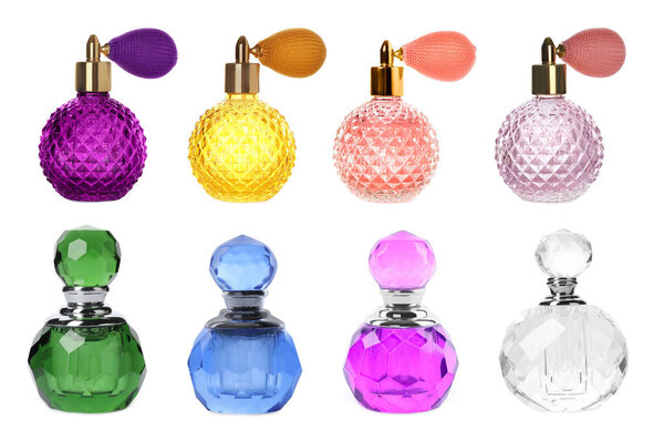 Set with different bottles of perfume on white background
