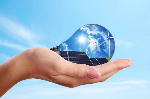 Alternative Energy Source Woman Holding Light Bulb Solar Panels Wind — Stock Photo, Image