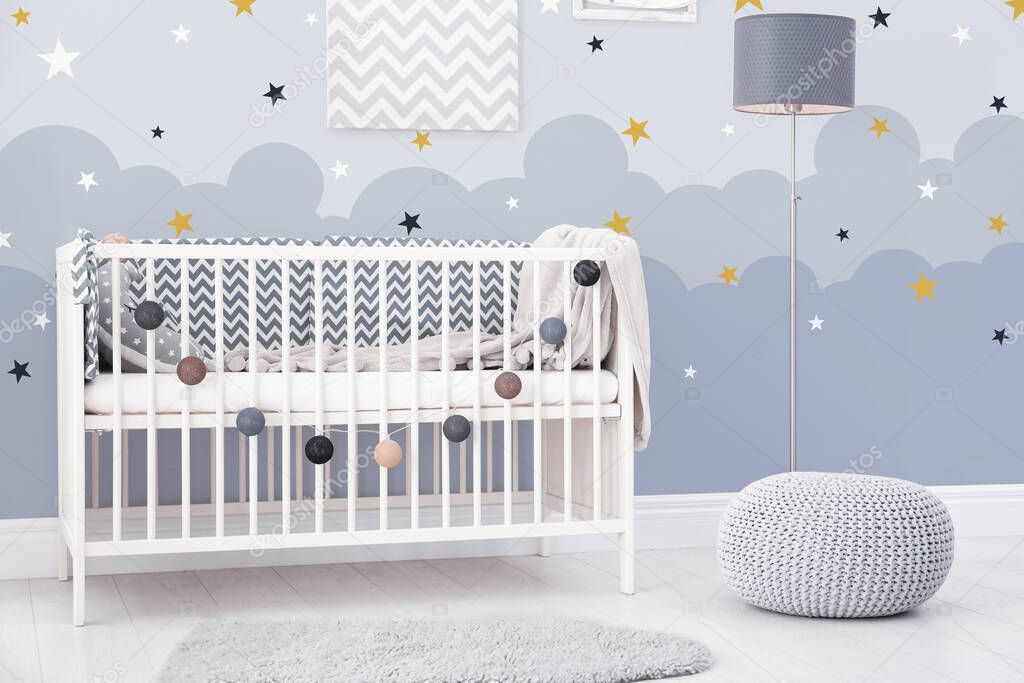 Baby room interior with comfortable crib 