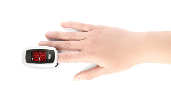 Kvinna Med Modern Fingertopp Puls Oximeter Vit Bakgrund Ovanifrån — Stockfoto