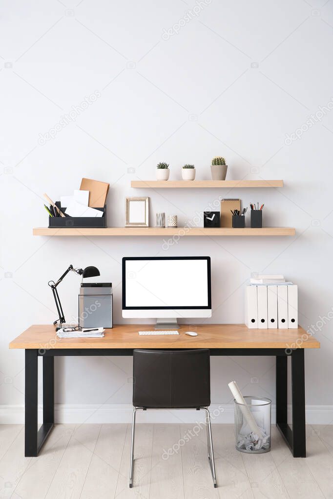 Modern computer on table in office interior. Stylish workplace