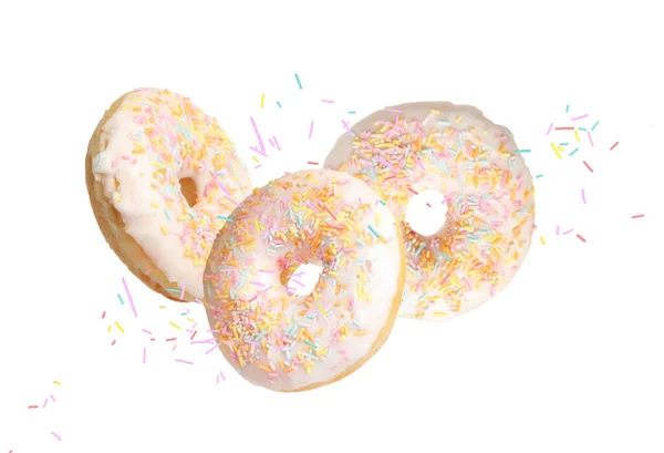 Set Von Fallenden Köstlichen Donuts Auf Weißem Hintergrund — Stockfoto