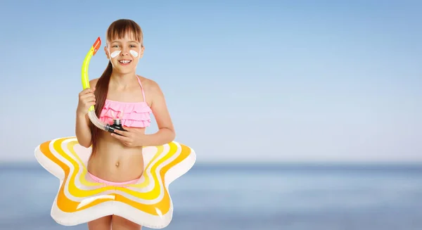Adorable Little Girl Sun Protection Cream Face Inflatable Ring Beach — Stock Photo, Image