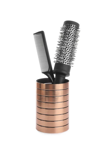 Modern hair brush and comb in holder isolated on white