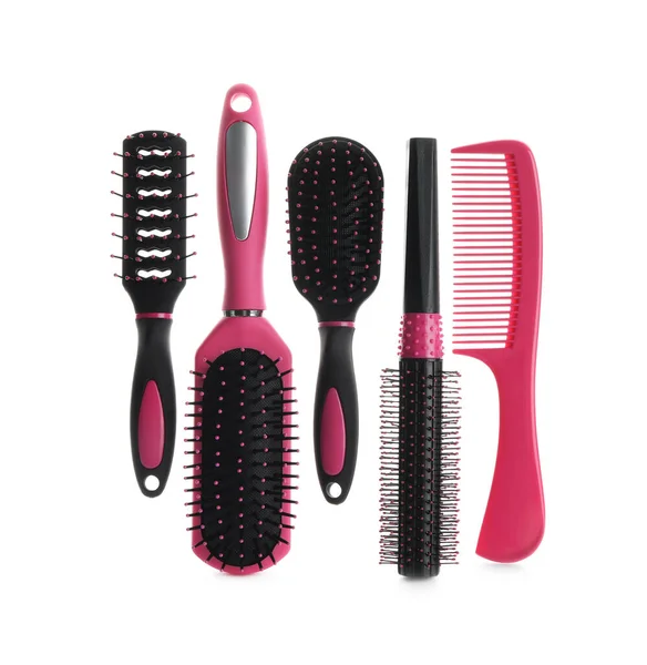 Set of professional hair brushes and comb isolated on white, top view