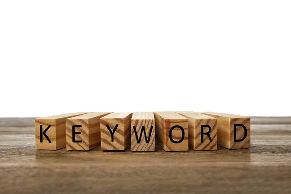 木のテーブルの上のブロックで作られた単語のキーワード — ストック写真