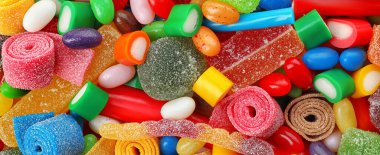 Delicious colorful chewing candies as background, top view. Banner design  clipart
