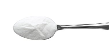 Spoon of baking soda isolated on white, top view clipart