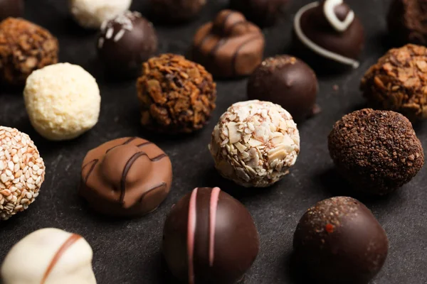 Different Delicious Chocolate Candies Black Table Closeup — Stock Photo, Image