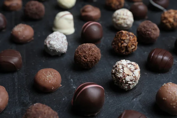 Different Delicious Chocolate Candies Black Table Closeup — Stock Photo, Image