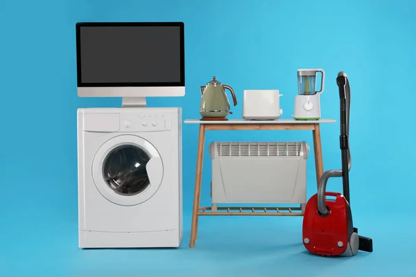 Set Diferentes Electrodomésticos Con Aspiradora Sobre Fondo Azul Claro —  Fotos de Stock