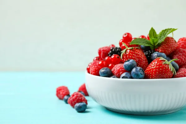 Mix Different Fresh Berries Mint Bowl Light Blue Wooden Table — Stock Photo, Image