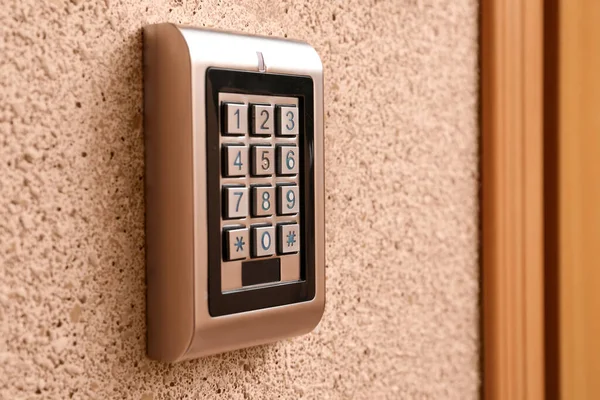 Keypad of modern electronic lock indoors, closeup