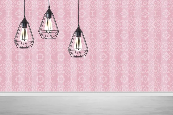 Stylish pendant lamps hanging near pink wall in room