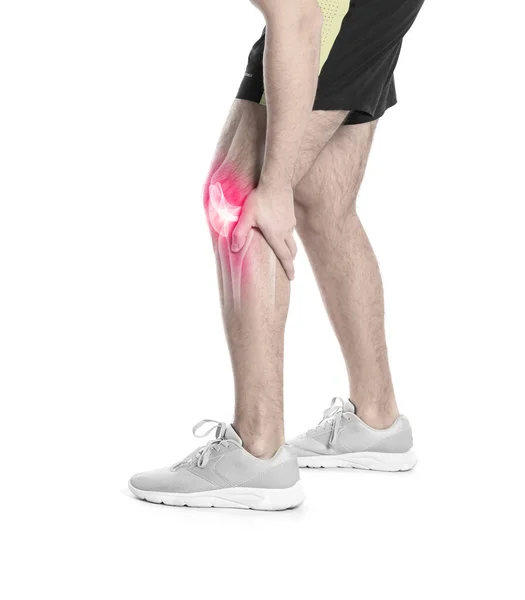 在白色背景下膝部疼痛的男人 — 图库照片