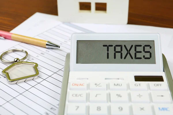 Calculatrice Avec Mot Taxes Documents Stylo Sur Table — Photo