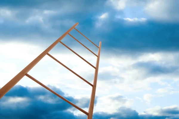 Wooden ladder against blue sky with clouds, low angle view