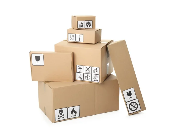 Cardboard boxes with different packaging symbols on white background. Parcel delivery