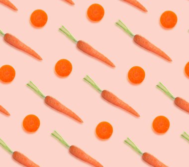 Soluk pembe arka planda havuçlar. Desen tasarımı