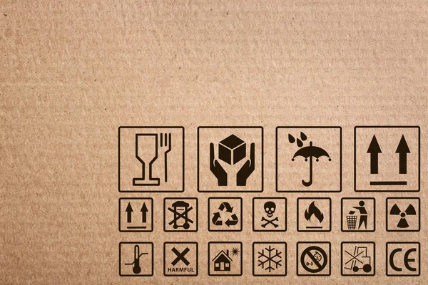 Cardboard Box Packaging Symbols Background Closeup — Stock Photo, Image