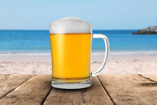 Cold Beer Wooden Desk Blurred Sea Sandy Beach Royalty Free Stock Photos