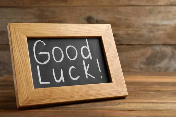 Blackboard Phrase Good Luck Wooden Table — Stock Photo, Image