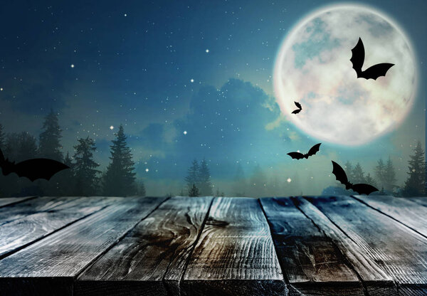 Wooden surface and bats flying in night sky with full moon. Halloween illustration