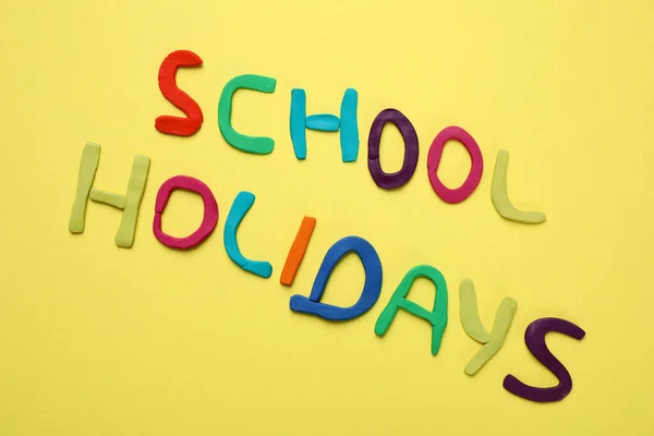 Phrase School Holidays Made Modeling Clay Yellow Background Top View — Stock Photo, Image