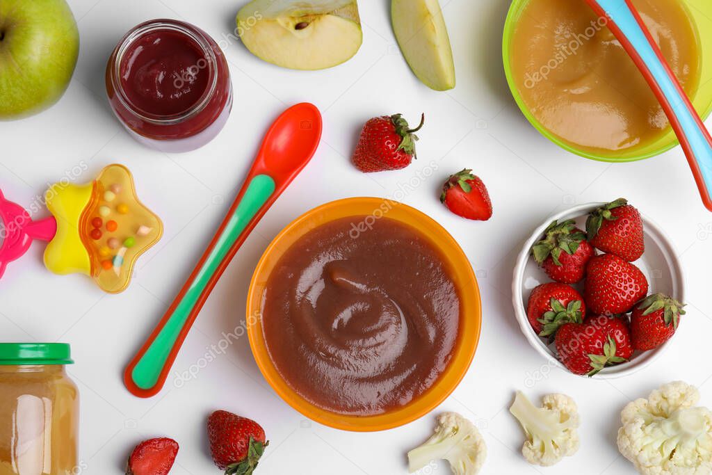 Flat lay composition with baby food and ingredients on white background
