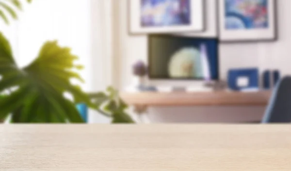 Wooden desk and blurred room on background. Home furniture