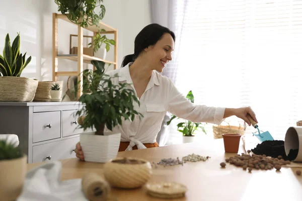 Mature Woman Potting Plant Home Engaging Hobby — Stock Photo, Image