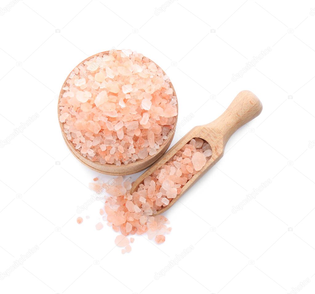 Bowl and scoop with pink himalayan salt on white background, top view