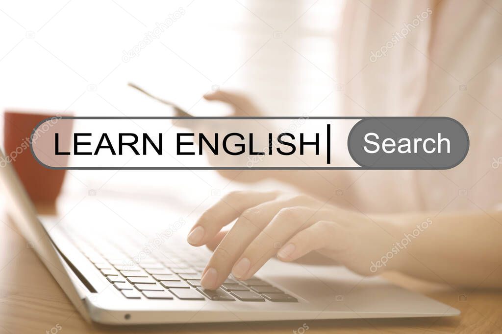 Search bar of internet browser with text Learn English and woman using laptop in office, closeup
