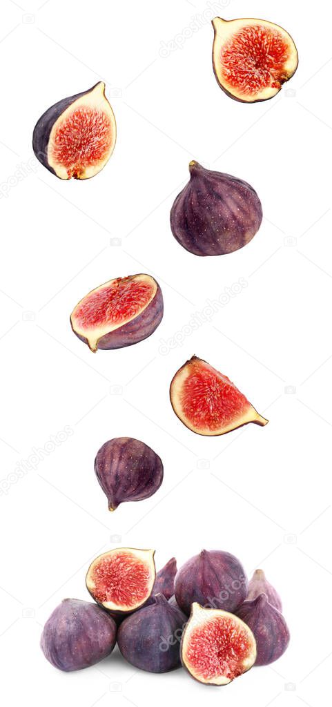 Cut and whole figs falling on white background