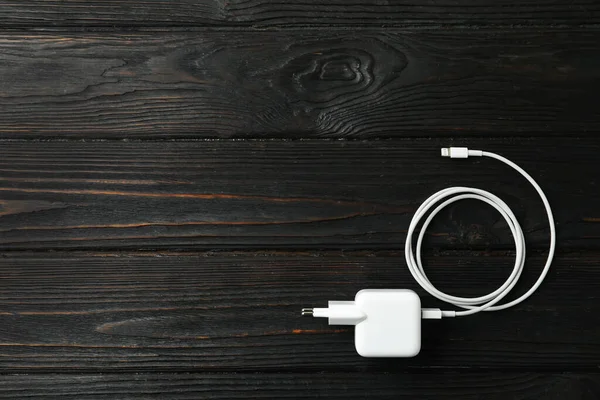 White Charging Cable Adapter Black Wooden Table Top View Space — Stock Photo, Image