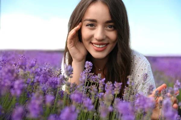 Young woman in lavender field on summer day